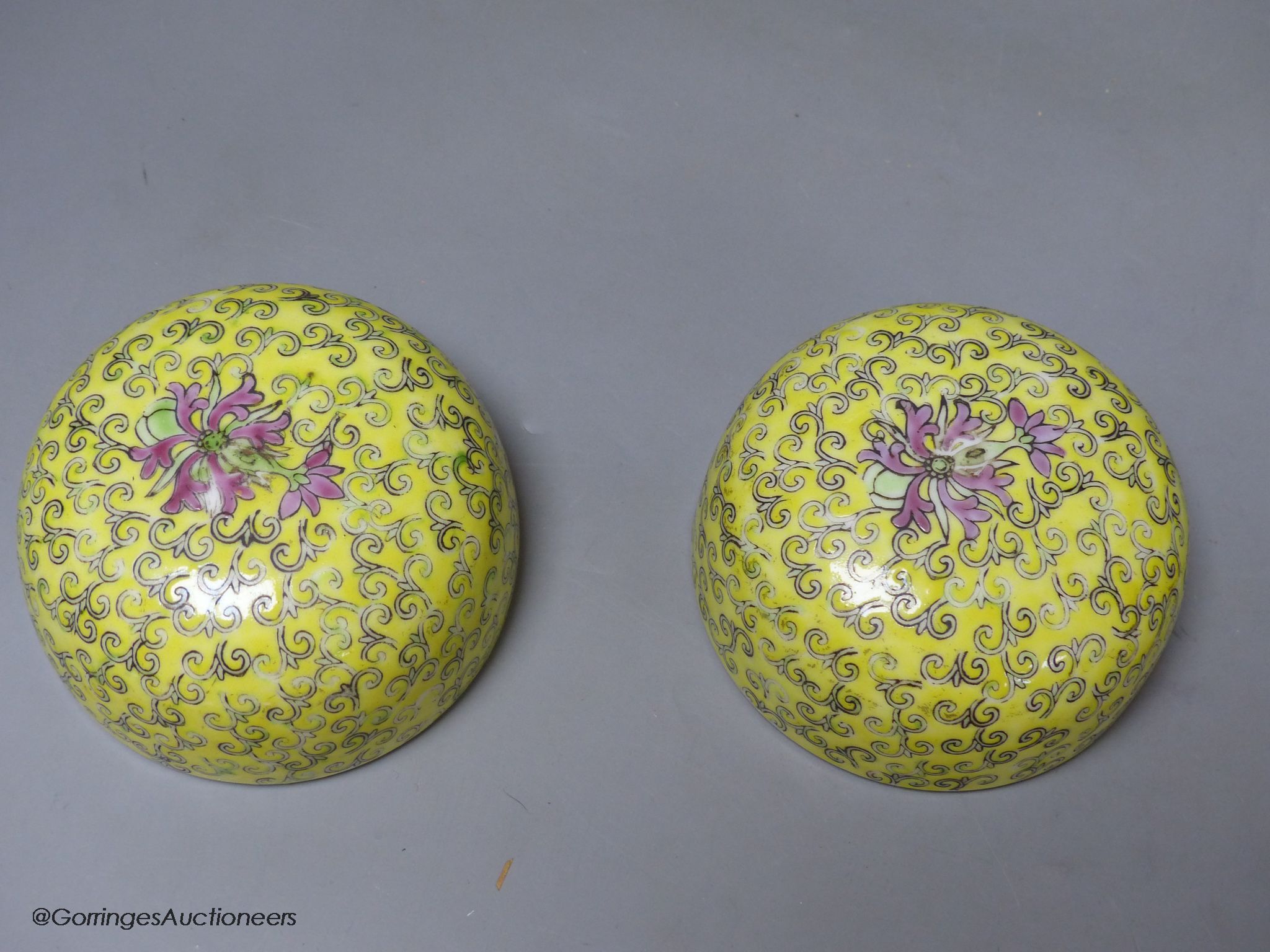 A pair of Chinese yellow ground vases and covers, height 30cm
